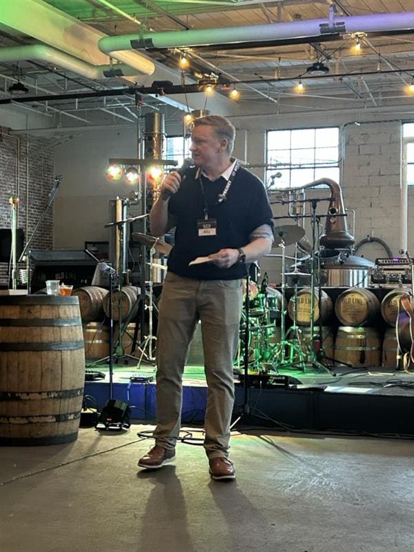 Bill Phillips speaking at Old Line Spirits